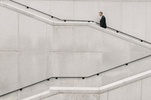 Businessman walking up the stairs